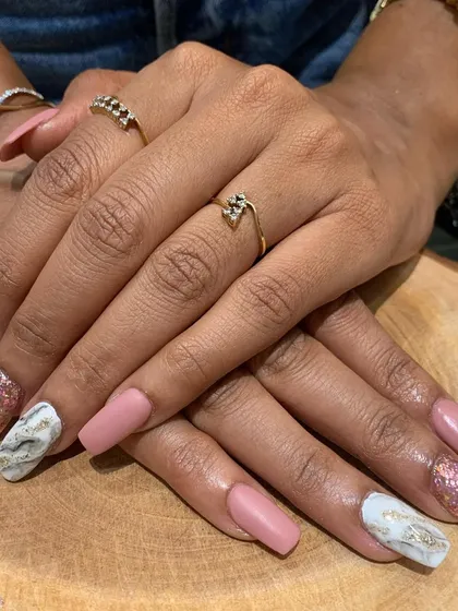 The full view of this gorgeous matte, glitter, and marble nail set. It's a perfect example of how to mix and match for a personalized look.