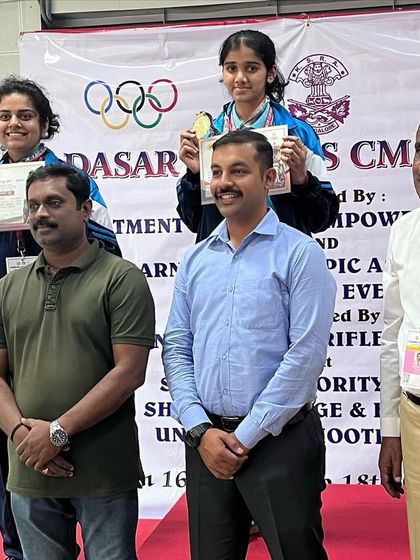 Anushka on the podium after her Gold medal win in the 50M 3-position rifle women's event at the Dasara Games.