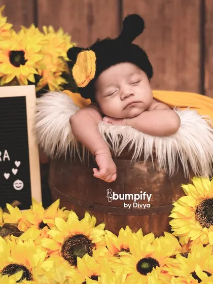 The little bee is fast asleep. This image combines the cute costume with a peaceful sleeping pose, showing the versatility of themed newborn shoots.
