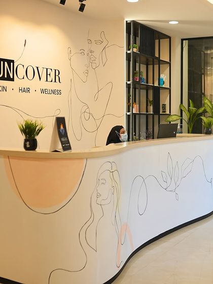 The reception area of our Noida clinic, featuring our signature line art and modern design.