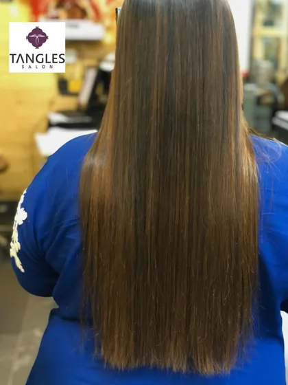 Another angle of the gold chocolate balayage and botox combination. You can see the smooth texture and how the light reflects off the healthy, conditioned hair strands.