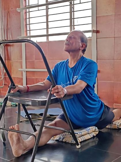 Here I am demonstrating Hanumanasana (splits) with the support of a chair and blankets. Props allow the body to ease into the full expression of the pose with correct alignment.