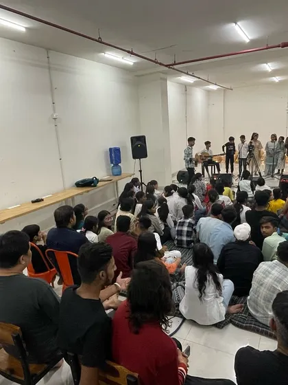 A full house at our Seekho Showcase. This image shows the packed, supportive audience that comes to cheer on our students, creating an electric atmosphere of encouragement and community spirit.