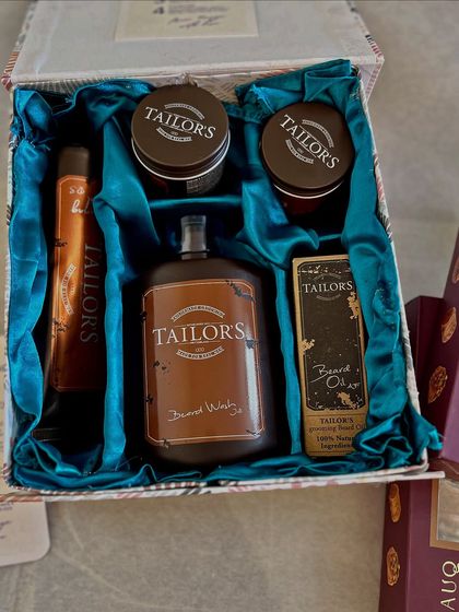 A look inside a grooming hamper curated for the groom. I styled this set of Tailor's products in a custom box with rich teal satin, ensuring the gift felt luxurious and personal.