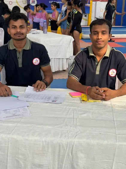 Our coaching staff at the judges' table. Their experience as both trainers and officials ensures our students are well-prepared for the competitive environment.