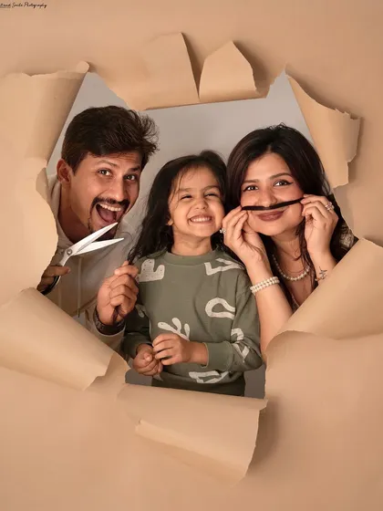 A first haircut is a huge milestone, and we decided to have some fun with it. This creative studio shot captures the playful chaos and excitement of this special family moment.