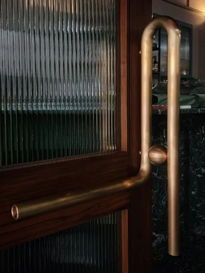 Every detail matters in creating a unique experience. For the Americano restaurant in Mumbai, we designed and commissioned this bespoke door handle, crafted from brass with a custom curve that provides a distinct tactile welcome for every guest.