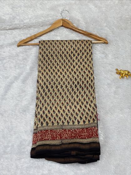 This beige and red Bagru printed saree is crafted from soft Chanderi silk. The classic combination of colors and patterns makes it a timeless piece for any ethnic wear lover.