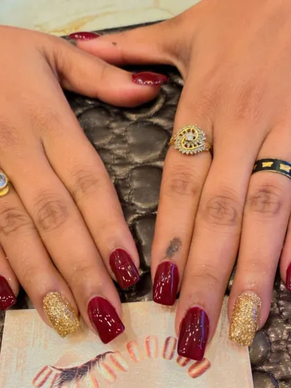 A timeless festive look with deep red and gold glitter on square nails. This combination is perfect for weddings, holidays, or any special event.