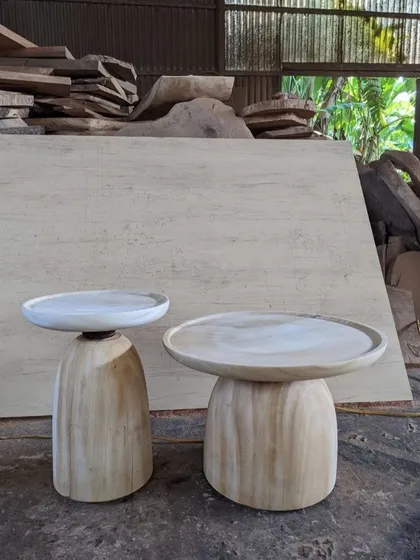 A pair of simple, elegant solid wood side tables.