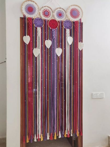 Another look at our custom macrame curtain, showing its full length and the beautiful tassels at the bottom.