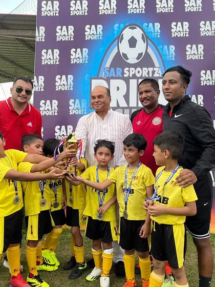 The team celebrating their victory at the Pride Cup. These experiences build confidence and a love for competition.