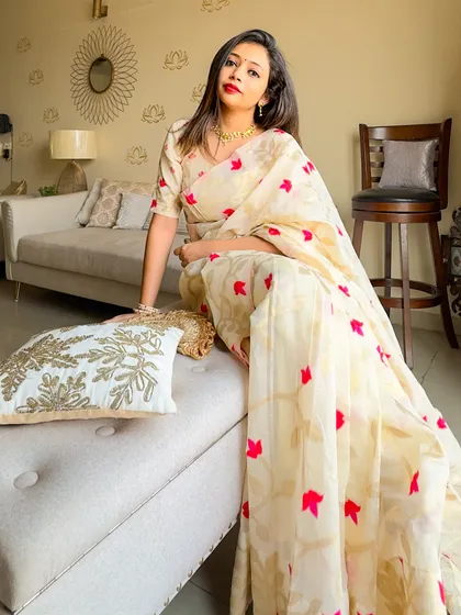 A relaxed pose showing the comfort and beauty of the Jamdani saree. Perfect for celebrating with family and friends.