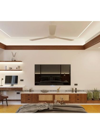 Functionality meets style in this bedroom design. We integrated a sleek work desk and shelving next to the bed, creating a multi-purpose space. The warm wood tones and under-shelf lighting ensure the workspace feels cohesive with the room's relaxing vibe.