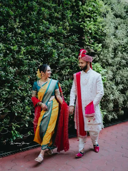 This is the kind of moment I live for. A happy, natural walk together after the rituals, with the bride in a traditional yellow and green Nauvari saree and the groom in his classic attire. It’s a perfect, unposed memory from a Maharashtrian wedding.