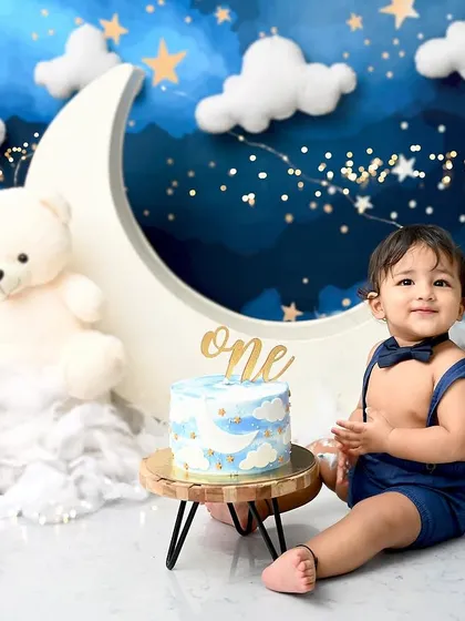 Another sweet moment from the starry night cake smash. His gentle smile and smart bowtie make this an incredibly charming birthday portrait.