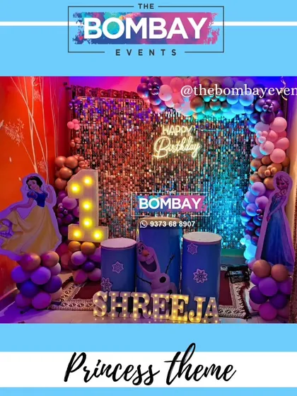 This princess theme combines characters from Frozen and other Disney movies. The setup features a sequin wall, a colorful balloon arch, and cutouts of Snow White and Elsa.