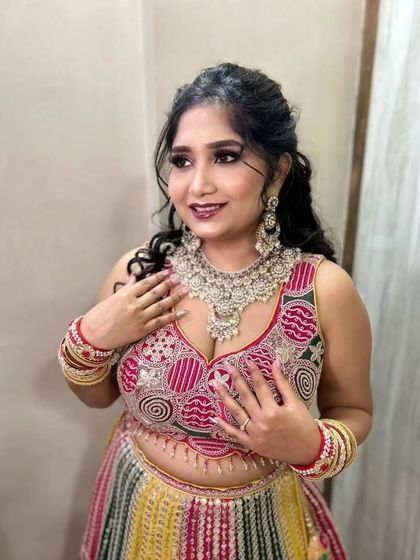 A close-up on the Sangeet glam. The focus is on the intricate silver jewelry and the beautifully blended smokey eye makeup.