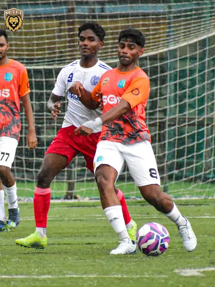 Shielding the ball from a defender. Physical strength and ball control are crucial in the competitive environment of the MFA leagues.