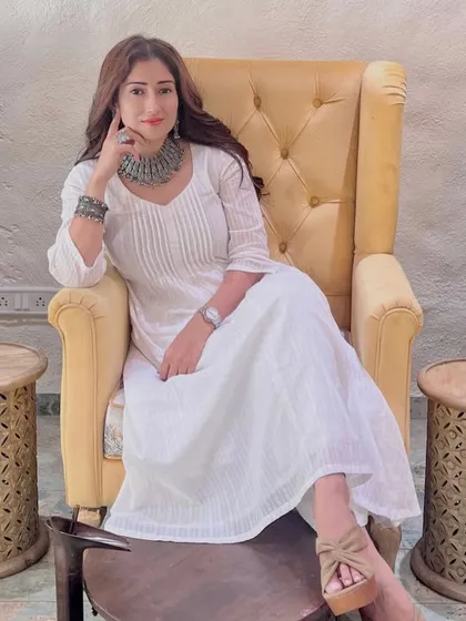 Relaxing in style. Gungun poses in our comfortable salon chair after her hair and nail services, looking effortlessly elegant.