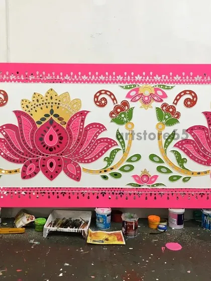 A closer look at a completed Lippan art panel featuring a bold, pink lotus design. We use vibrant acrylics and carefully placed mirrors to make our floral patterns pop, perfect for adding energy to any wall.