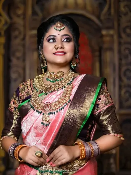 This series features a model in a pink and brown saree, wearing a heavy bridal set with green stone accents, showcasing a complete and regal look.