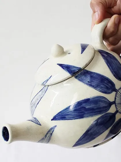 My 'Bloom & Brew' teapot is designed for those who cherish their tea rituals. The bold, hand-painted indigo florals on the off-white ceramic body turn a simple daily routine into a moment of beauty and slow living.
