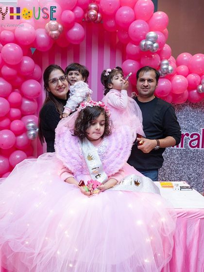 A magical moment as Nirali, dressed as Barbie, celebrates with her family and a stunning light-up Barbie cake.