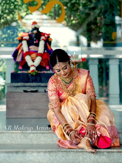 A candid shot of the bride during her wedding photoshoot. The makeup is designed to look flawless both in person and in professional photographs.