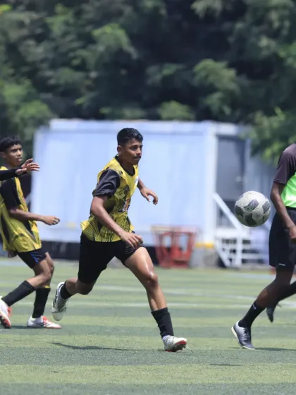 A player advancing with the ball, looking to break through the defensive line. This captures the forward-thinking, attacking style of our teams.