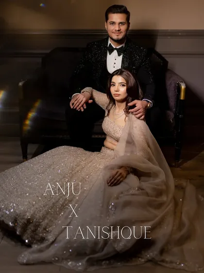 A regal and stylish engagement portrait. The couple is posed like royalty, showcasing their elegant attire and confident connection.
