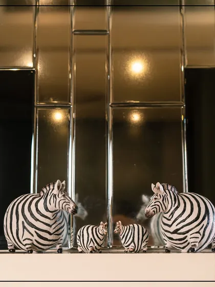 I dare to explore modern luxury with the Wild Noir Collection. These striking zebra figurines, set against a sleek backdrop, celebrate fierce beauty and the power of monochrome, bringing a dramatic yet elegant statement to the contemporary home.