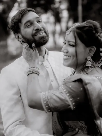 Sometimes, a moment is best captured in black and white. This removes all distractions and focuses purely on the joy and laughter shared between the couple, creating a truly timeless and emotional photograph.