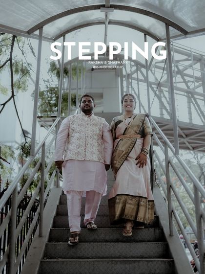 "Stepping" into their future together. This engagement photo uses the lines of a staircase to create a dynamic shot of the couple.