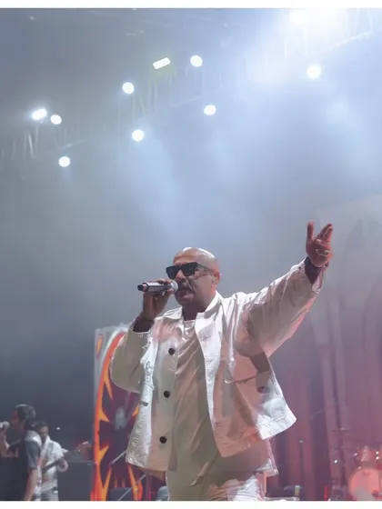 Vishal Dadlani commanding the stage. The bright, dramatic lighting and smoky atmosphere are all part of the concert-level production I bring to my events.