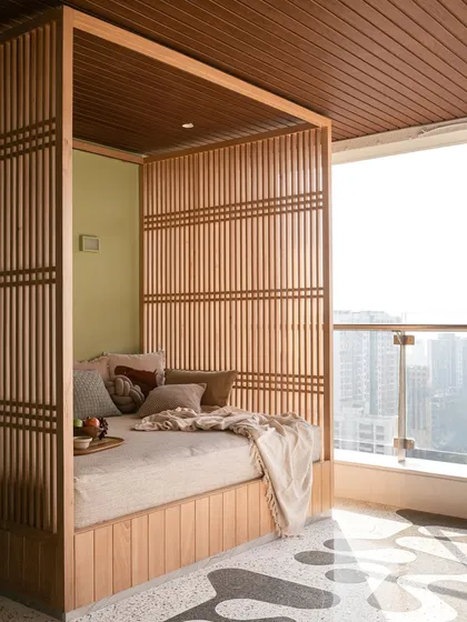 For this sea-facing Mumbai terrace, we designed a serene escape with a custom daybed and a sleek, reversible swing. The furniture is designed to be both durable for the outdoors and elegant enough to complement the stunning city views, creating a perfect spot for lazy afternoons or lively evenings.