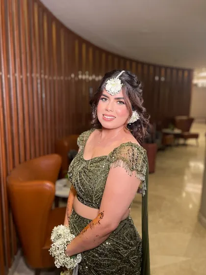 Green and gorgeous! My beautiful bride Simi chose a dreamy Mehendi look with an olive green lehenga and floral jewelry. The makeup was kept soft and glowing to complete the magical vibe.