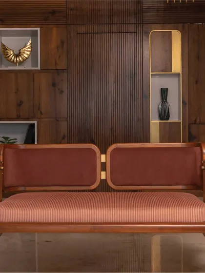 A closer look at the custom-designed reversible swing, a signature piece from my 'Objects by Soch' collection. This piece exemplifies my commitment to craftsmanship, combining the warmth of teak wood with elegant brass fixtures and plush upholstery to create functional art.