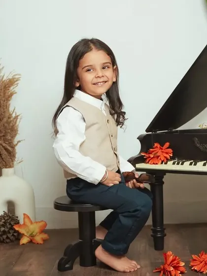 A full view of our vintage piano setup, perfect for capturing timeless portraits of your child.