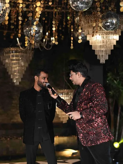 Interacting with the groom during the Sangeet. These one-on-one moments on stage help build a connection and bring out the couple's personality for all the guests to see.