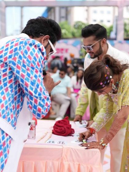 The bride trying her hand at one of the carnival games, fully engaged in the fun and festive atmosphere I create.