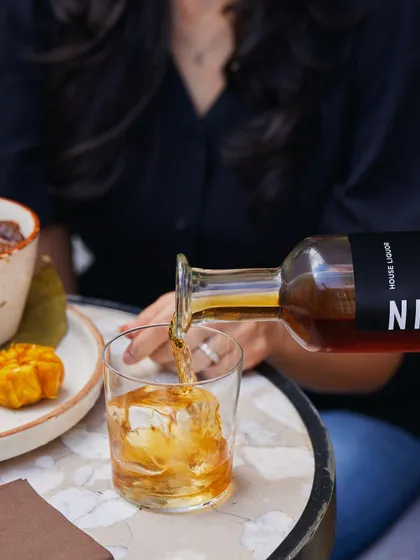 A pour of our house-infused Vanilla Cognac over a large ice cube. This is the perfect way to enjoy the spirit's rich aroma and complex flavour profile.