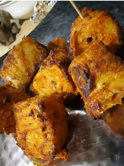 For seafood lovers, I offer this Tandoori Fish Tikka. The boneless fish pieces are marinated in a tangy yogurt and spice mix, then grilled in the tandoor until perfectly tender and flaky.