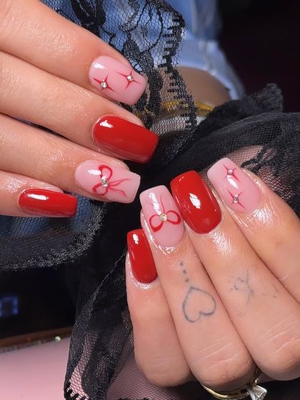 Another view of this festive red bow design, showing how the elements are placed differently on each hand for a custom feel.