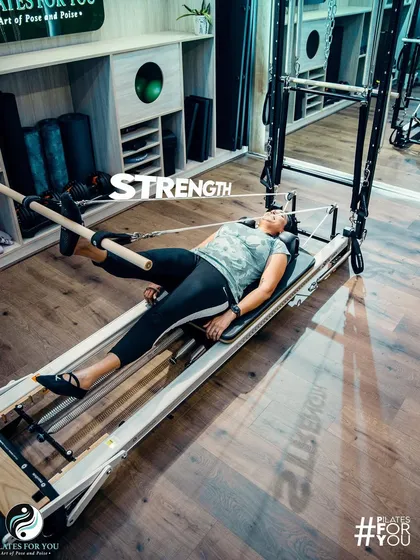 This exercise on the reformer uses the push-through bar to build leg and glute strength. The focus is on slow, controlled movements to maximize muscle engagement.