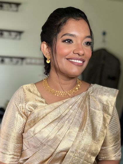 Bride Preeti, looking elegant for her church wedding. She wore a beautiful gold saree, and we kept her makeup soft and radiant to match.
