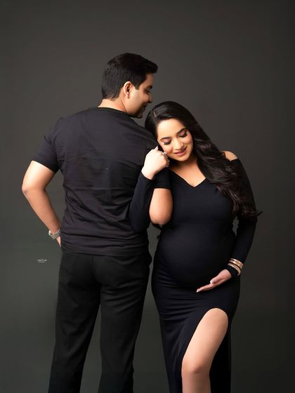 A sweet and gentle pose from behind. This shot beautifully captures the protective and loving embrace of the partner.