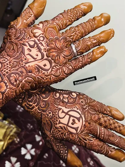 Another beautiful example of custom initial mehendi. I carefully integrate your chosen letters and names into the flowing patterns, creating a secret message of love within the art.
