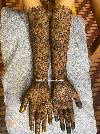 This design features a unique pattern on the palms with a focus on bold, central motifs.