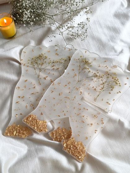 These are the components of my resin holy book stand, or rihal. Each piece is embedded with dried flowers and gold details before being assembled into the final stand.